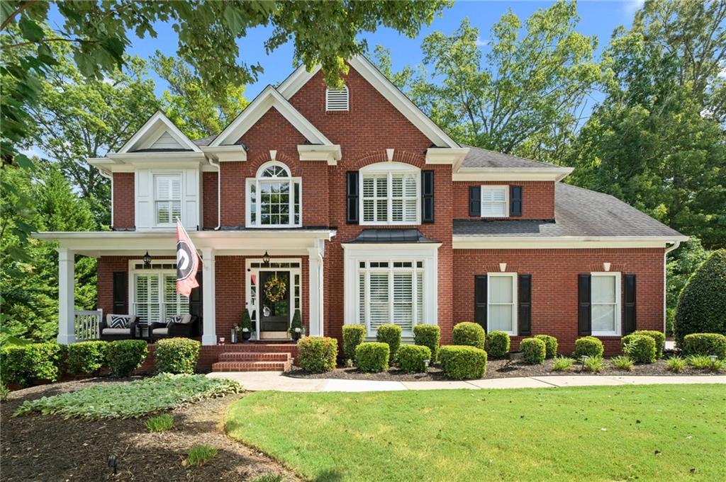 front view of a house with a yard