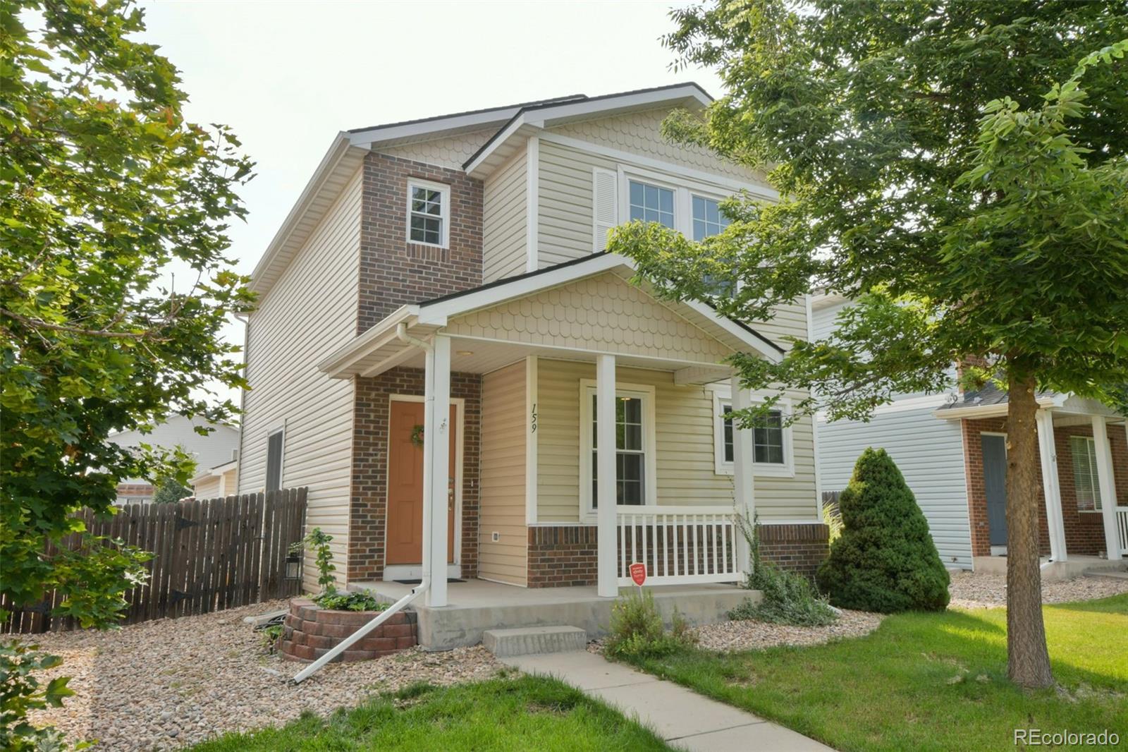 front view of a house and a yard