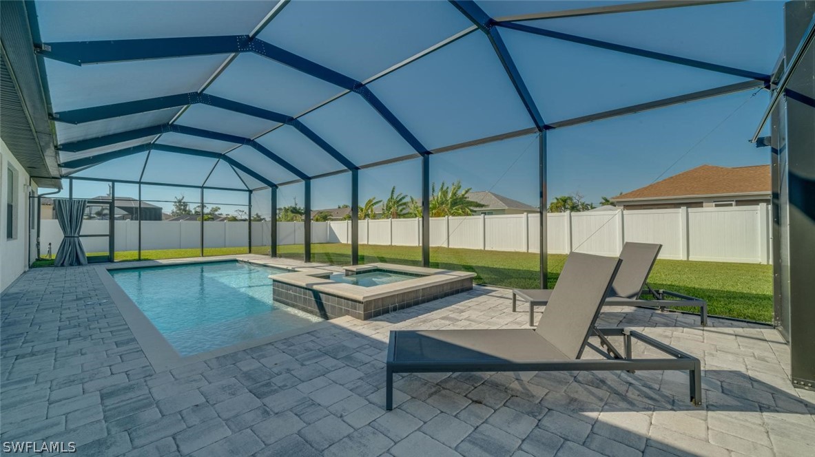 a patio with a patio table and chairs under an umbrella