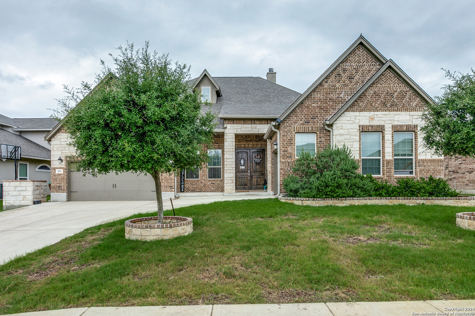 a front view of a house with a yard