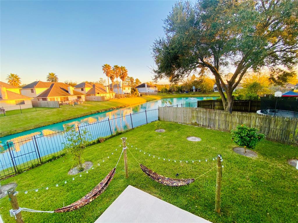 a view of a swimming pool with a garden