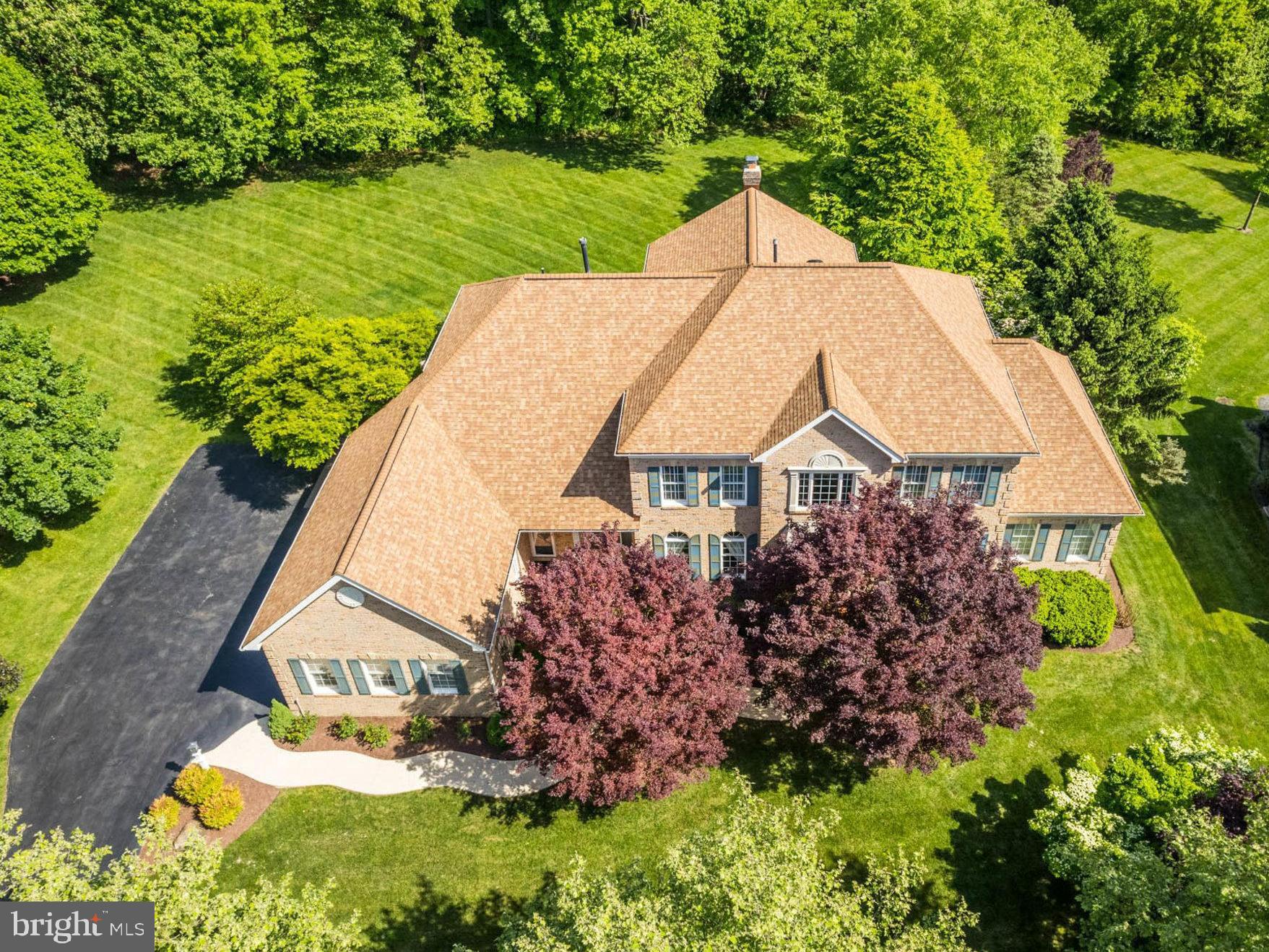 a aerial view of a house with a yard