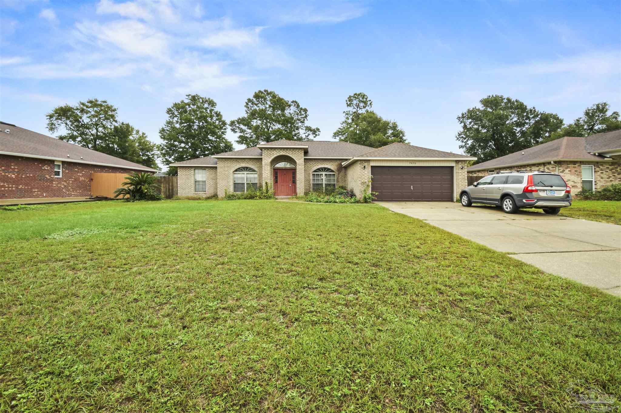 front view of a house with a yard