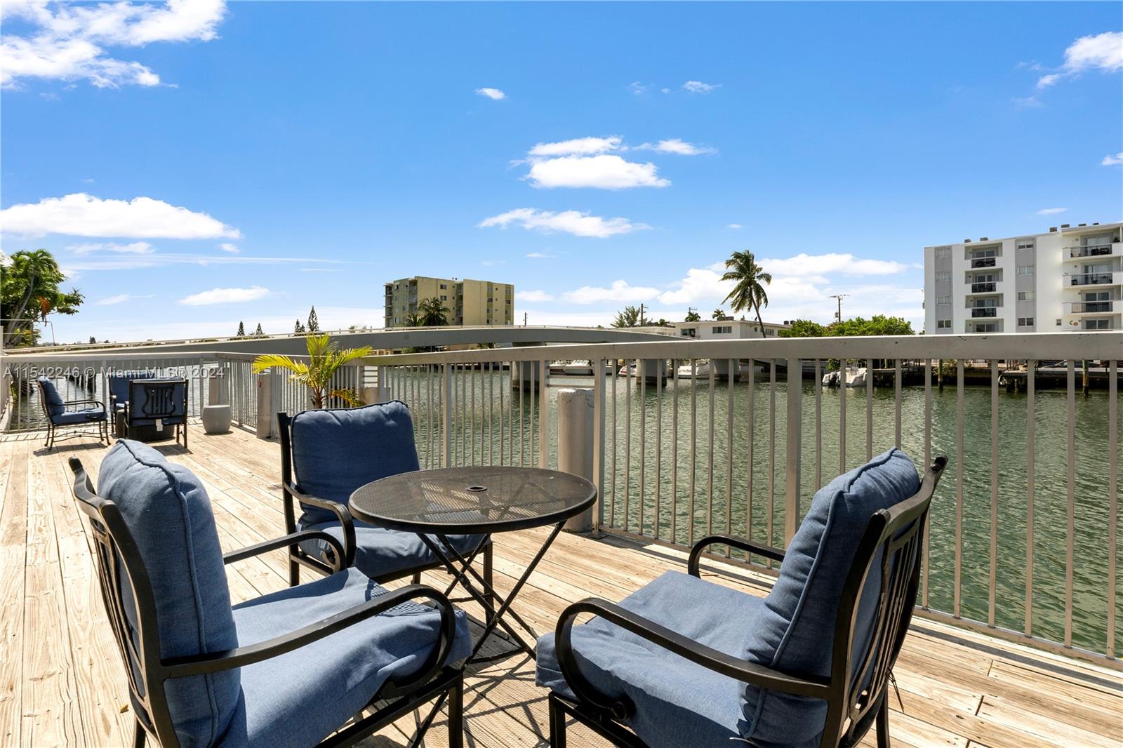 a view of a chairs and table in patio