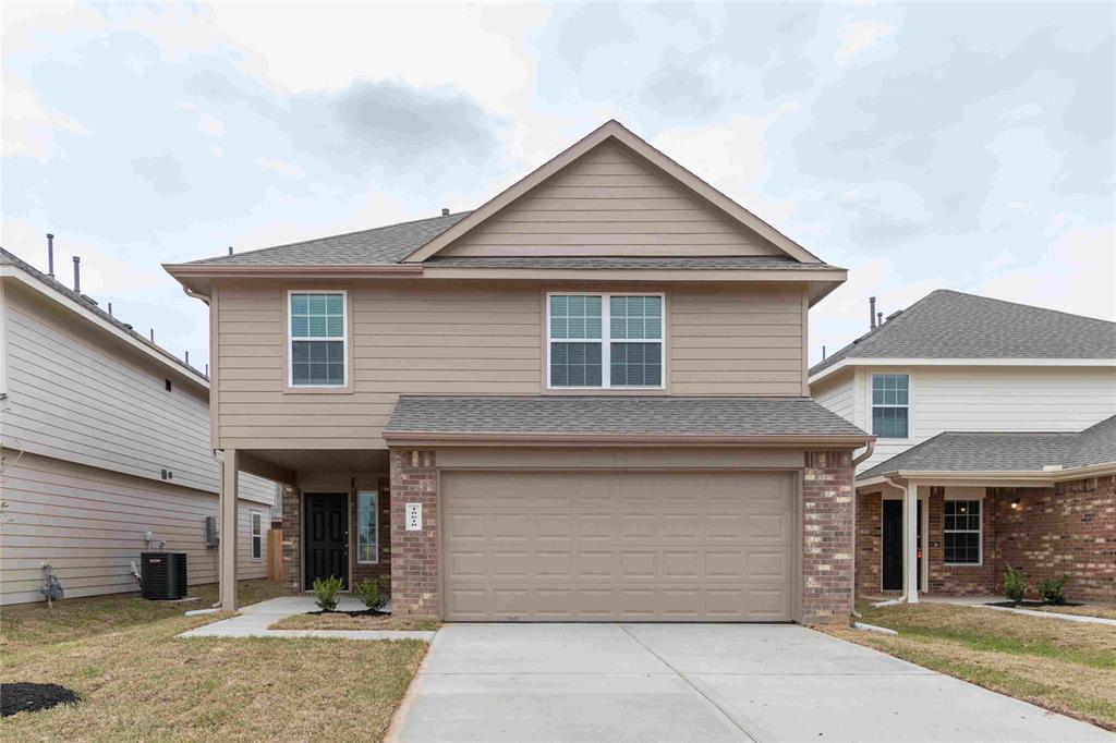 a front view of a house with a garage