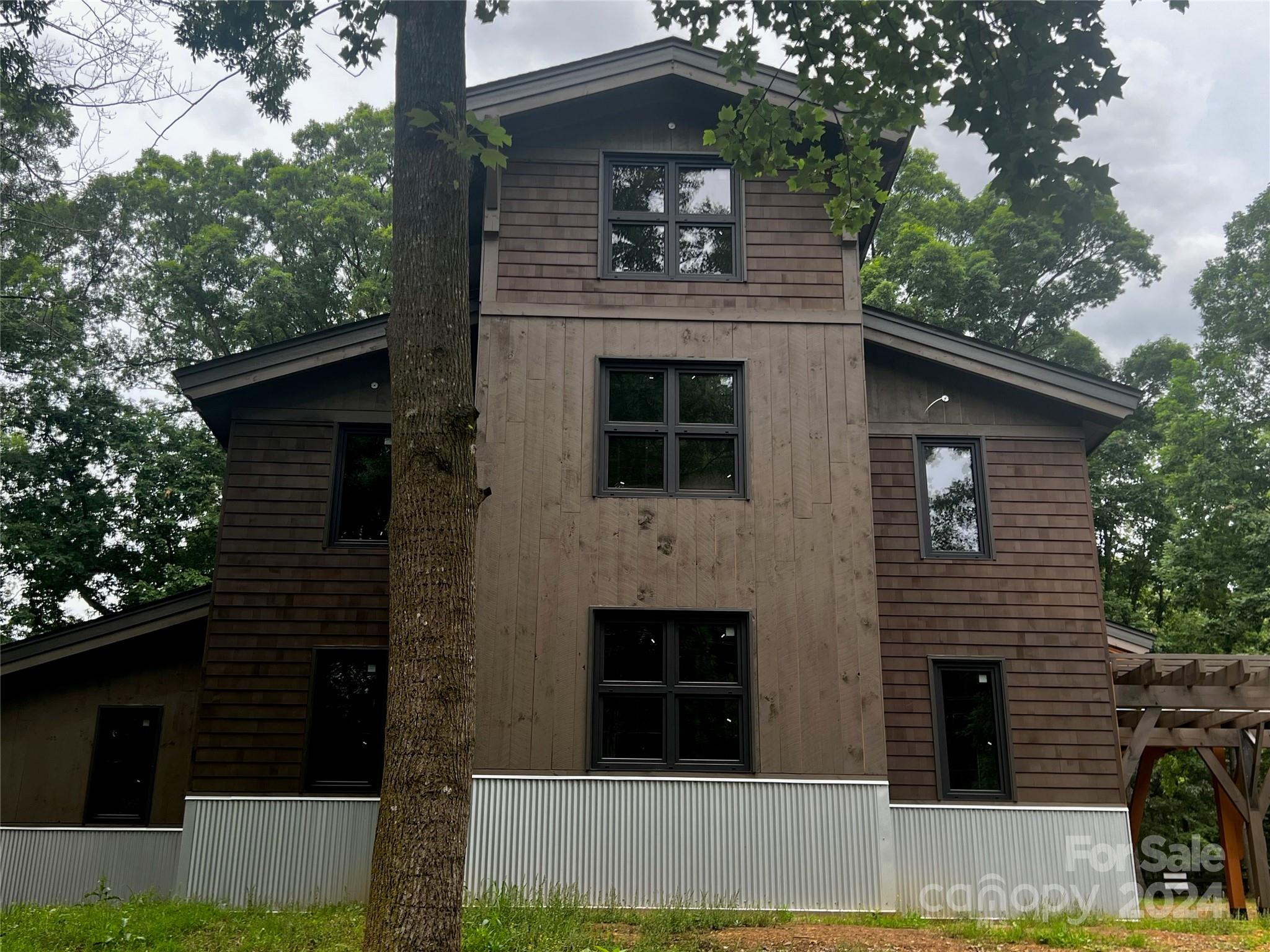 a front view of a house with yard