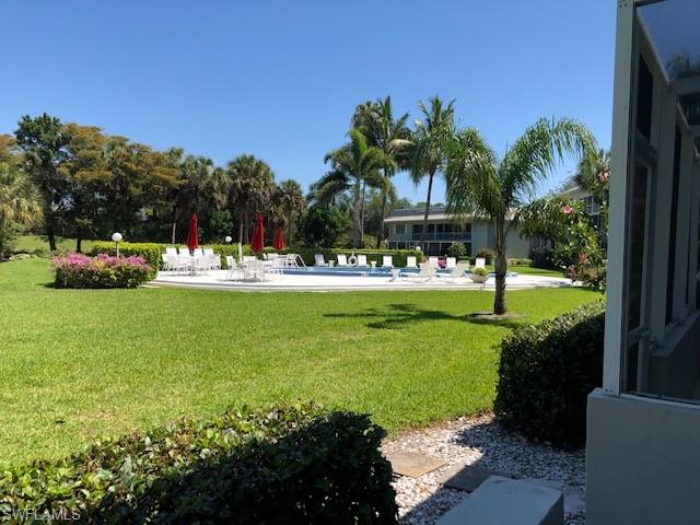 a view of a park with swings and slides