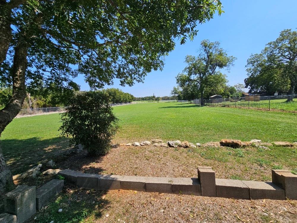 a view of a lake with a yard