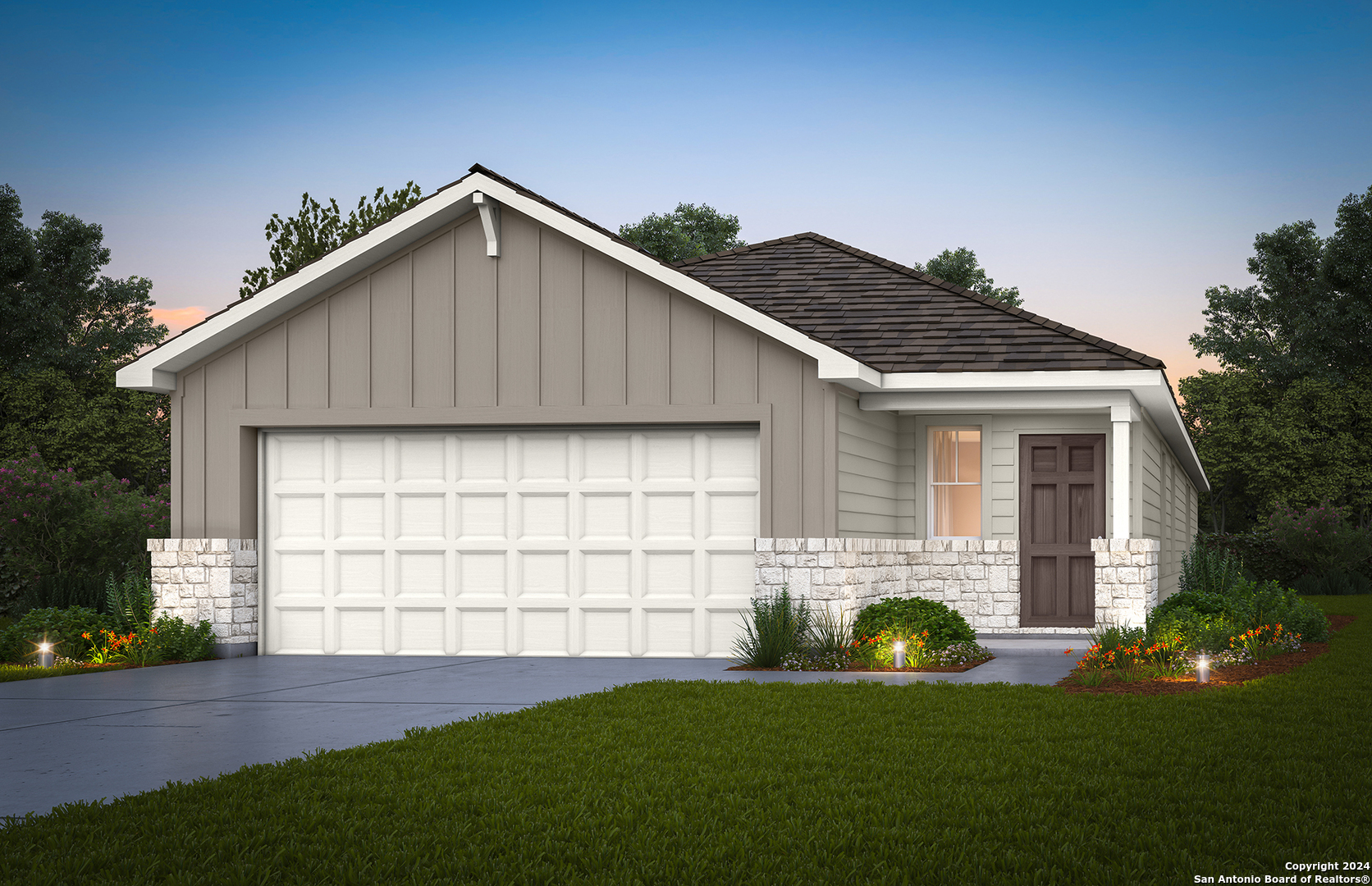 a front view of a house with a garden and yard