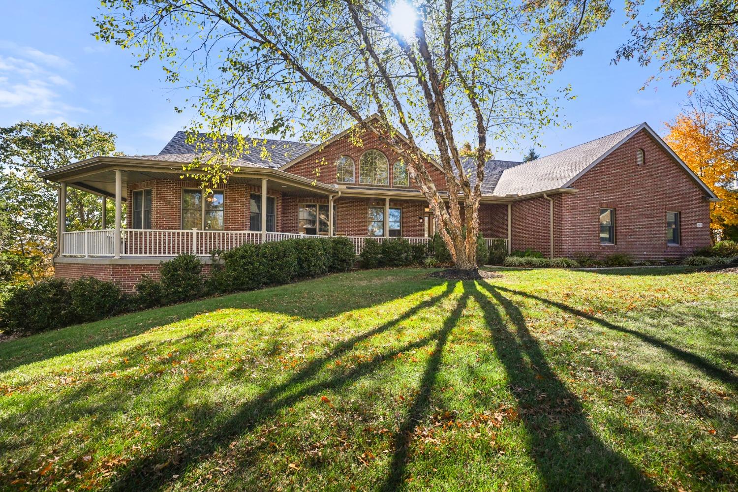 Striking brick ranch with wrap porch