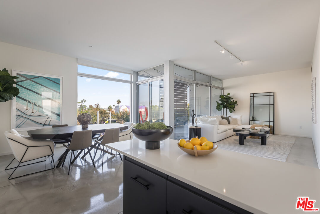 a kitchen with a table and chairs