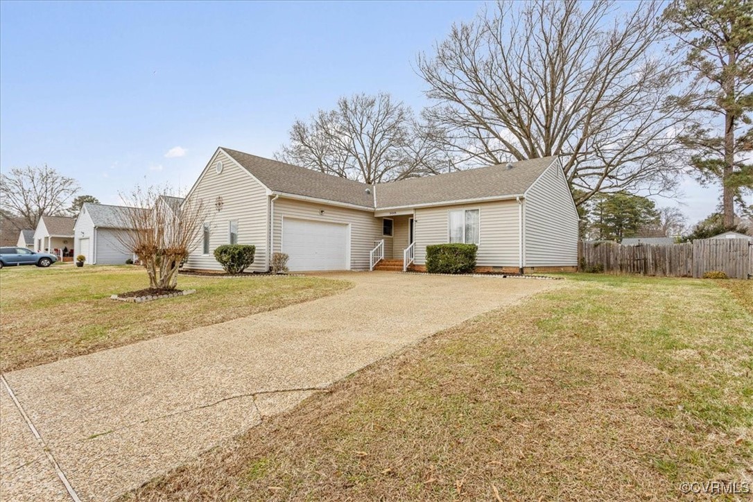 View of front of house featuring a garage and a fr