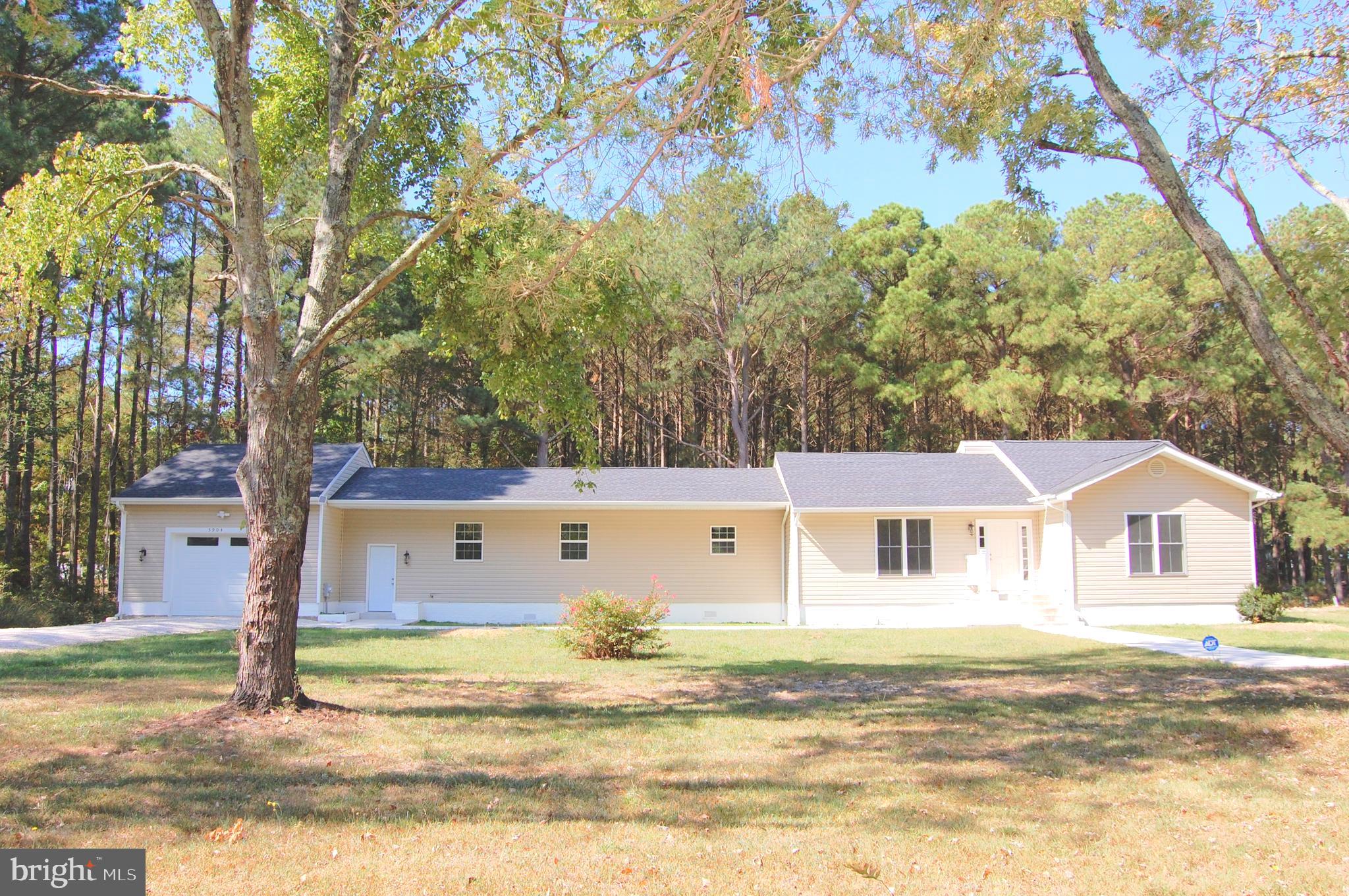 a view of house with a swimming pool