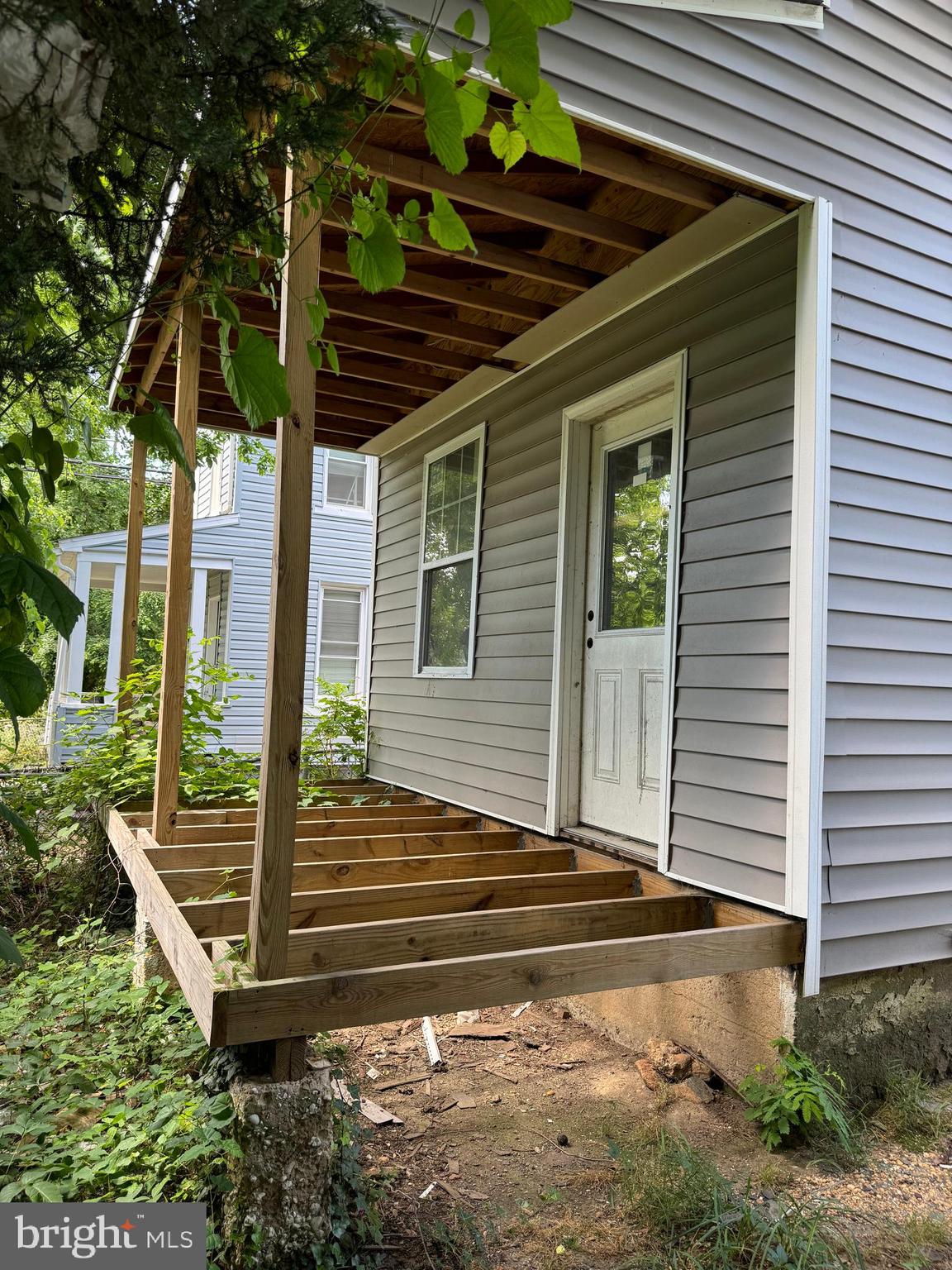 a view of house with backyard