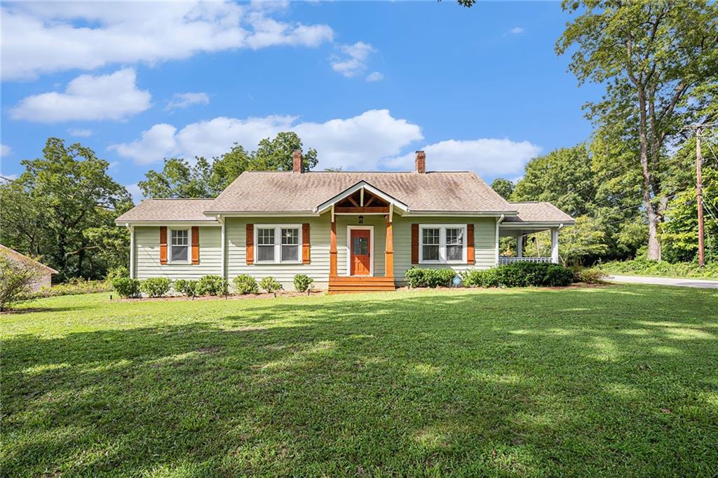 a front view of house with yard and green space