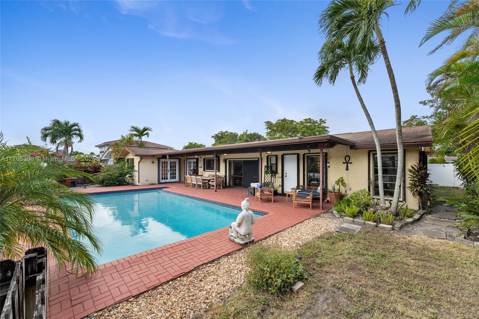 a front view of house with yard and outdoor seating