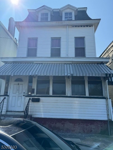 a front view of a house with stairs