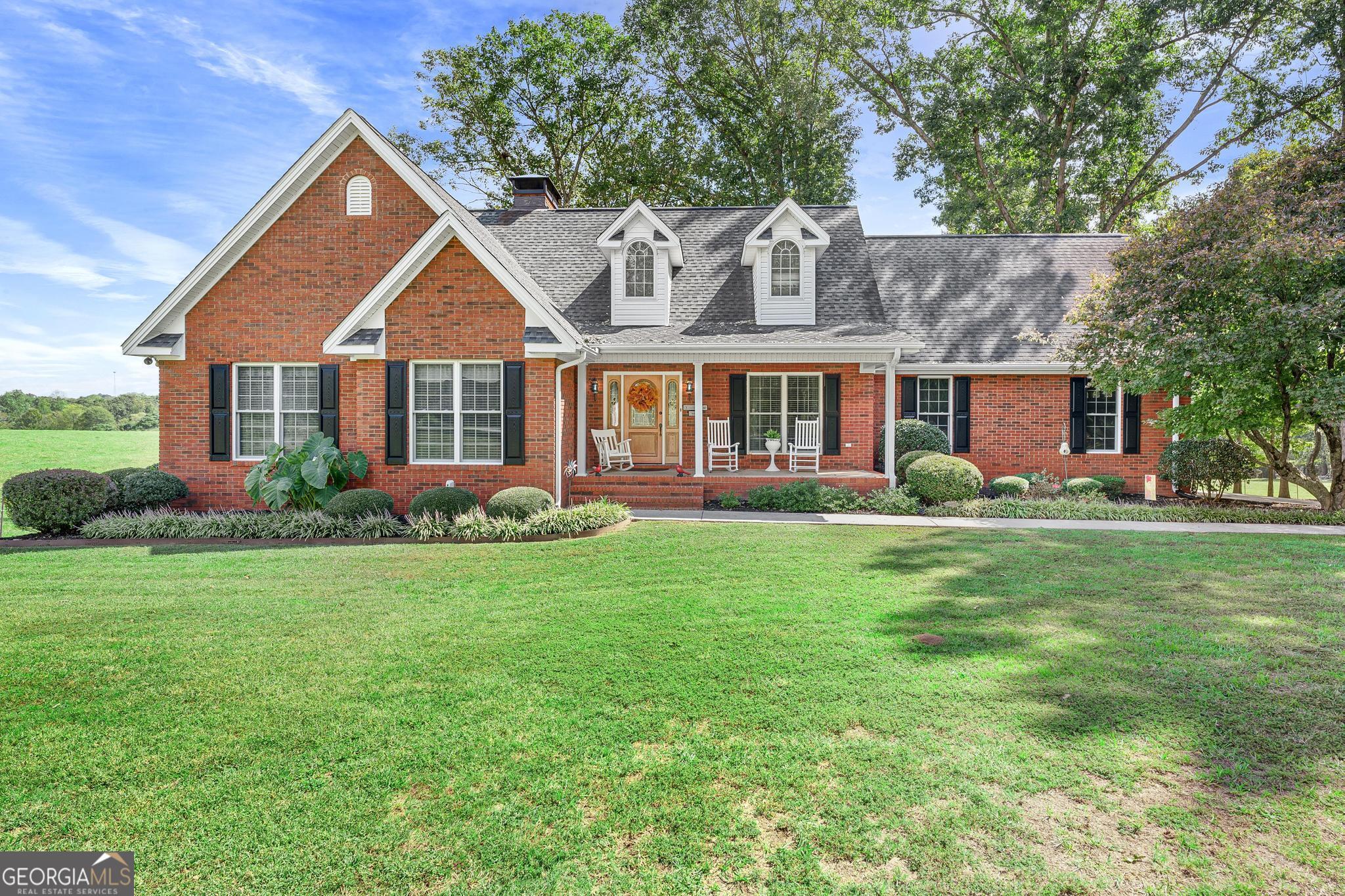 front view of a house with a yard