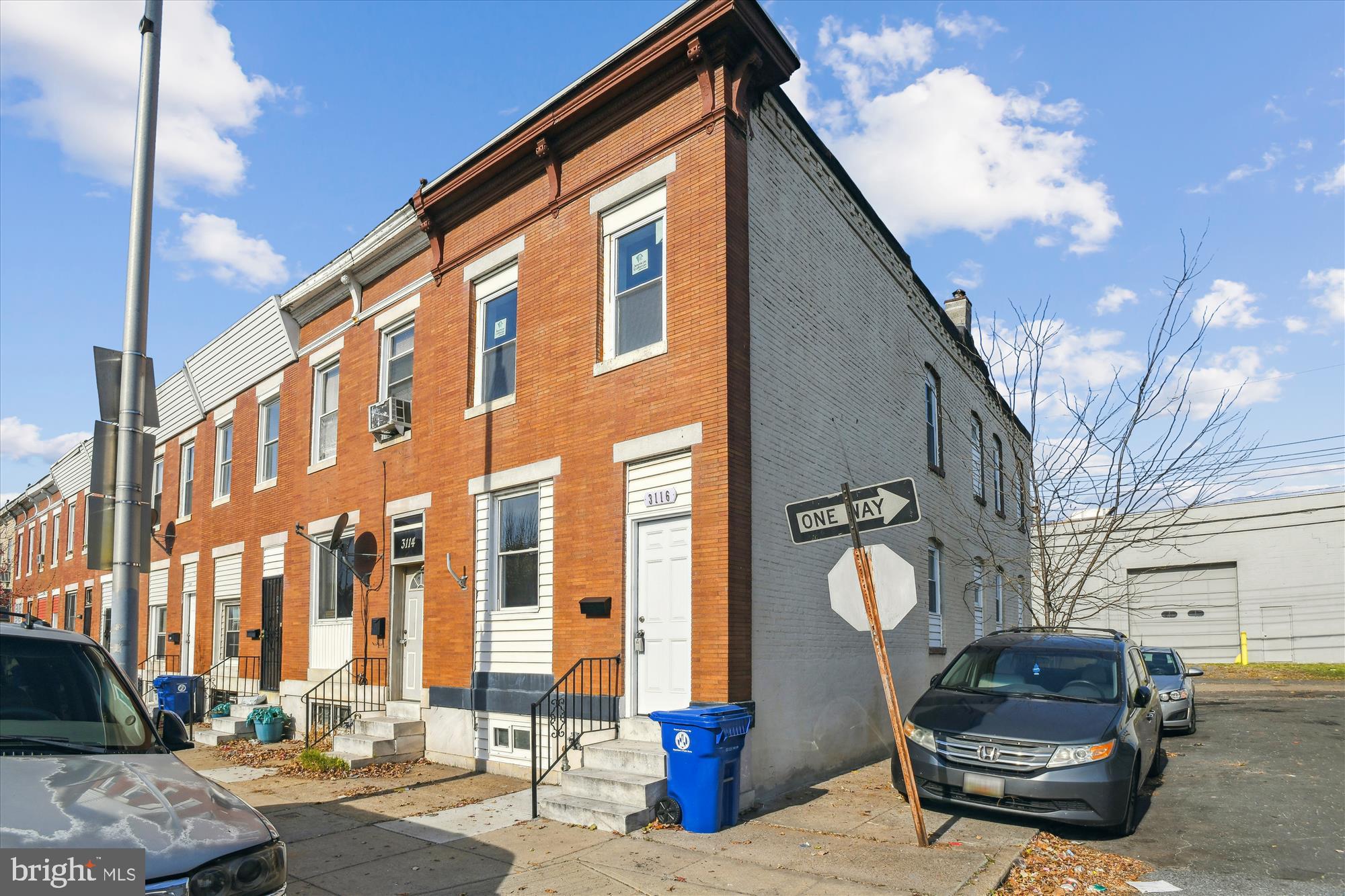 a front view of a building with parking