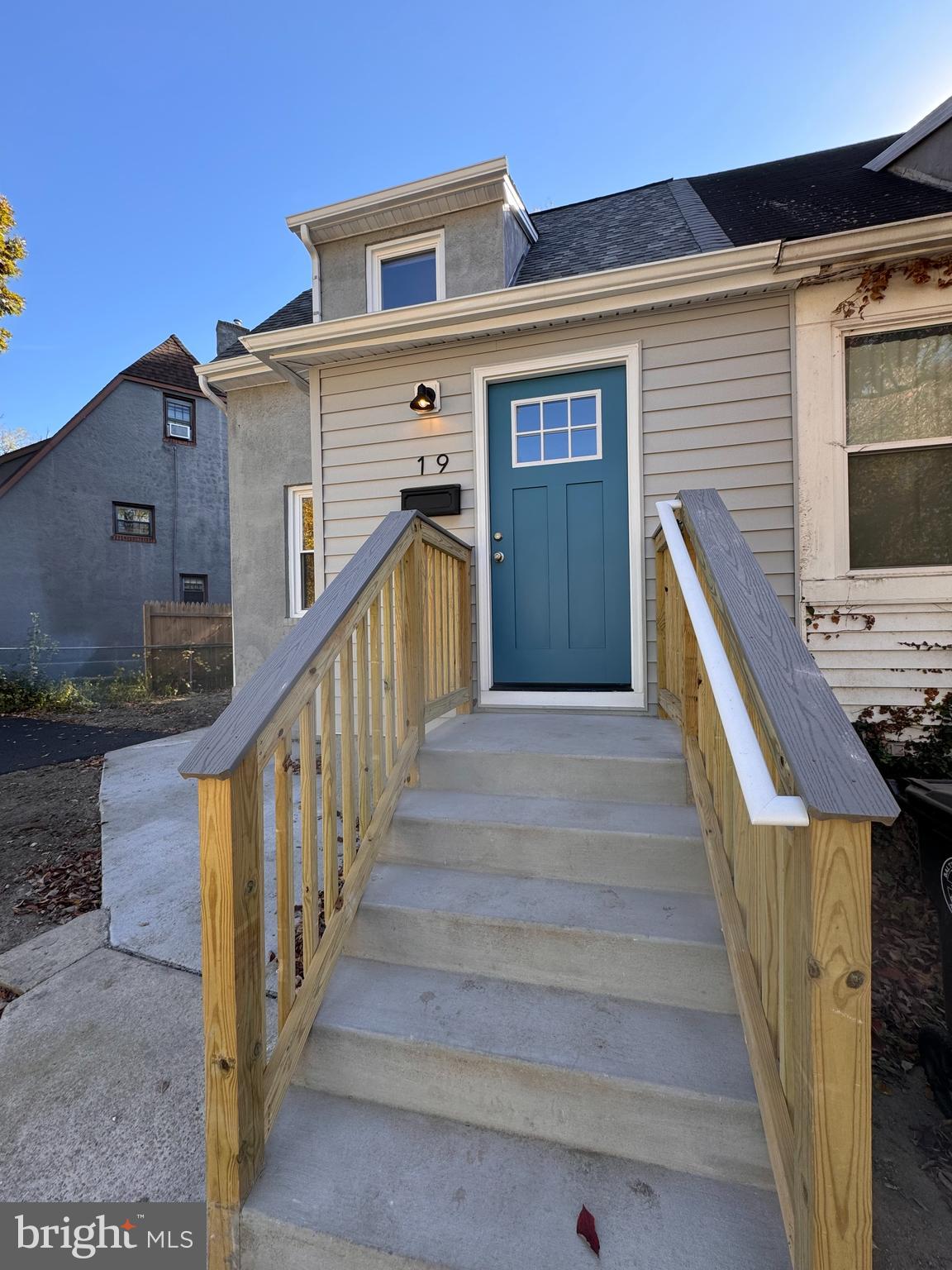 a view of a house with wooden stairs