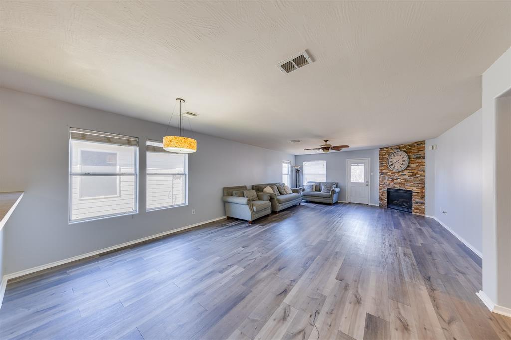 a view of a livingroom with furniture and wooden floor