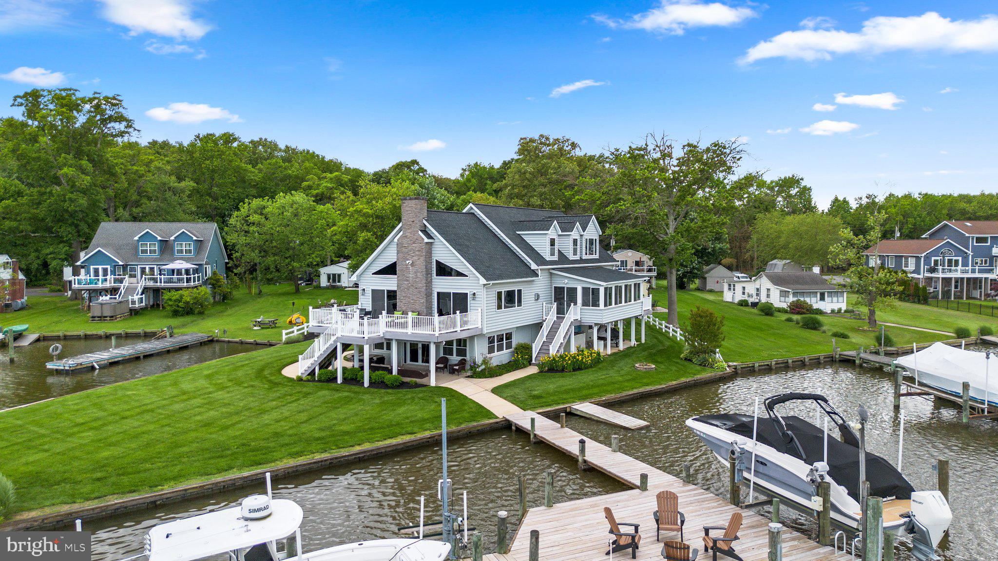 an aerial view of a house with a big yard