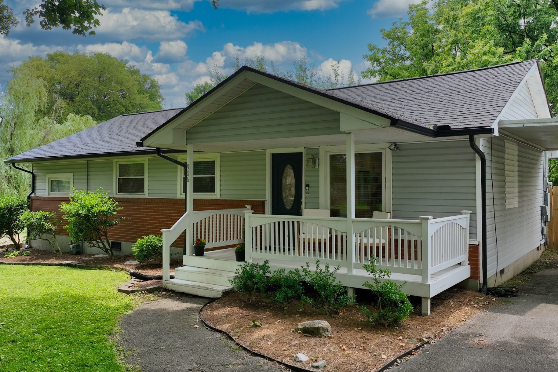 a front view of a house with garden