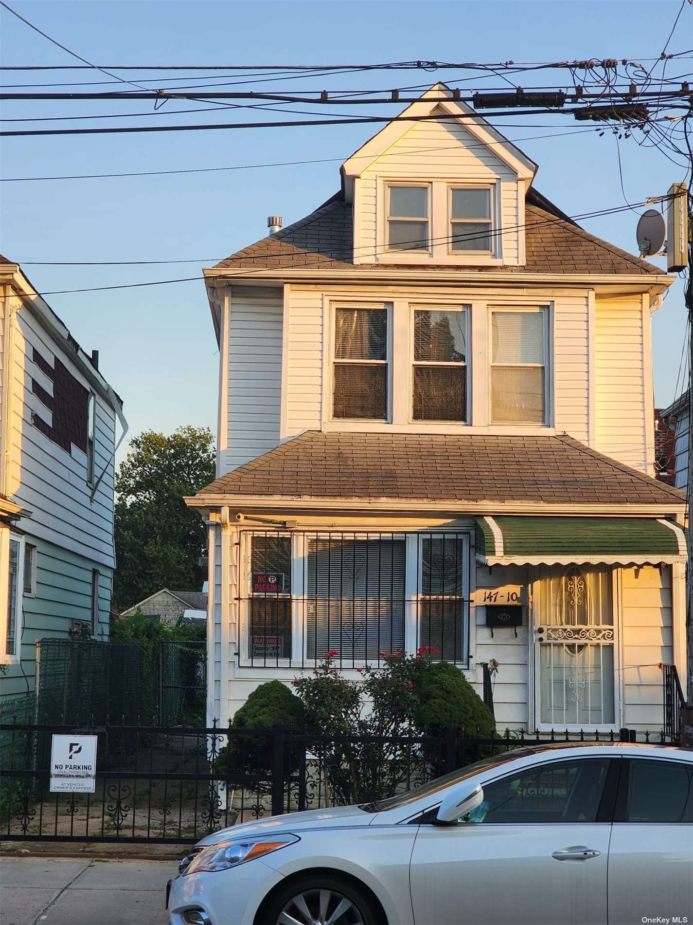 a front view of a house with yard