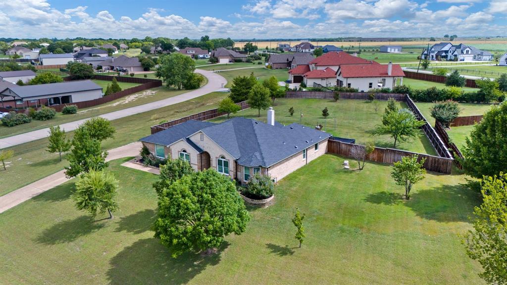 an aerial view of a house with a garden