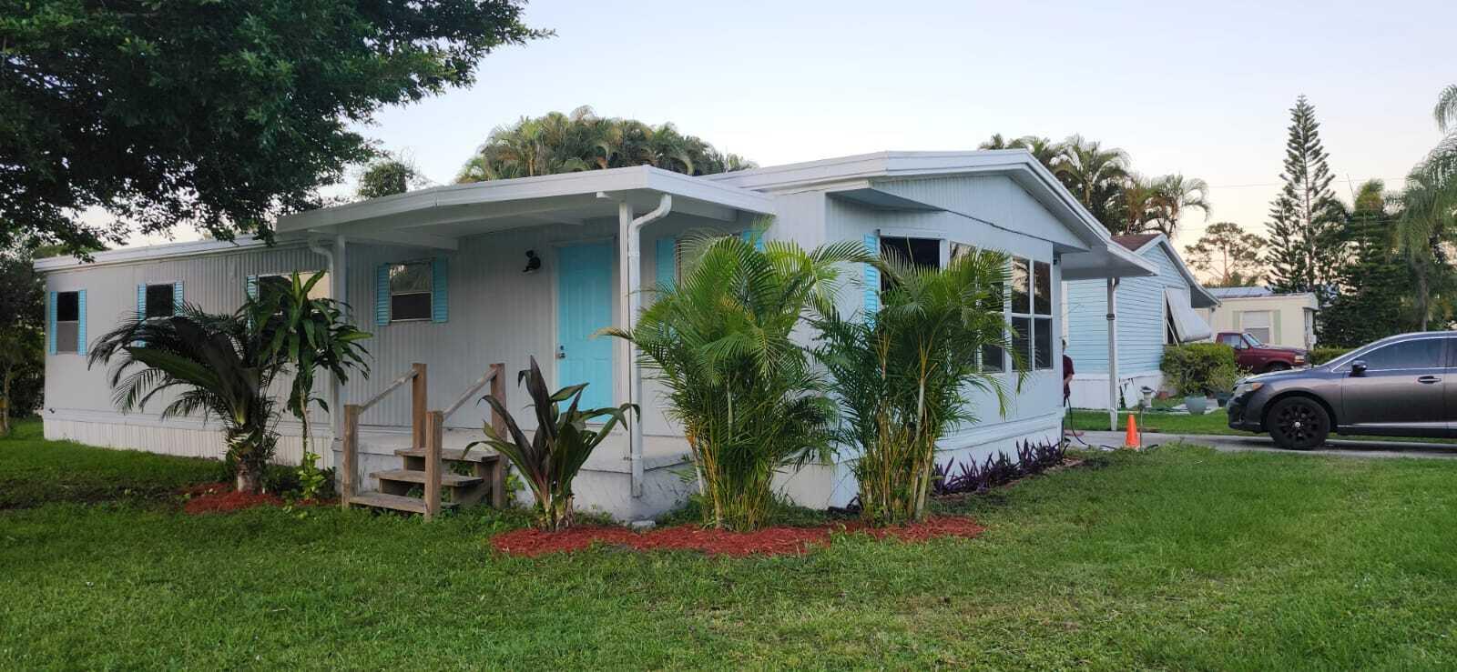 a view of front a house with a yard