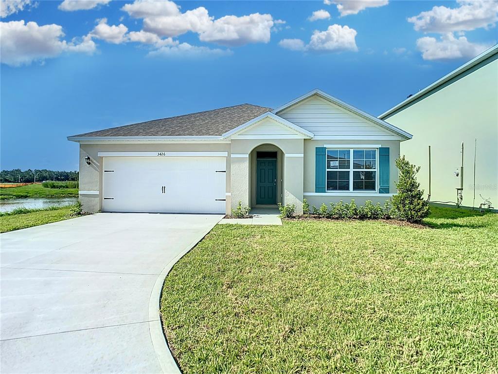 a view of a house with a yard