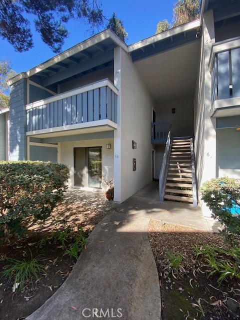 a view of house with backyard and porch