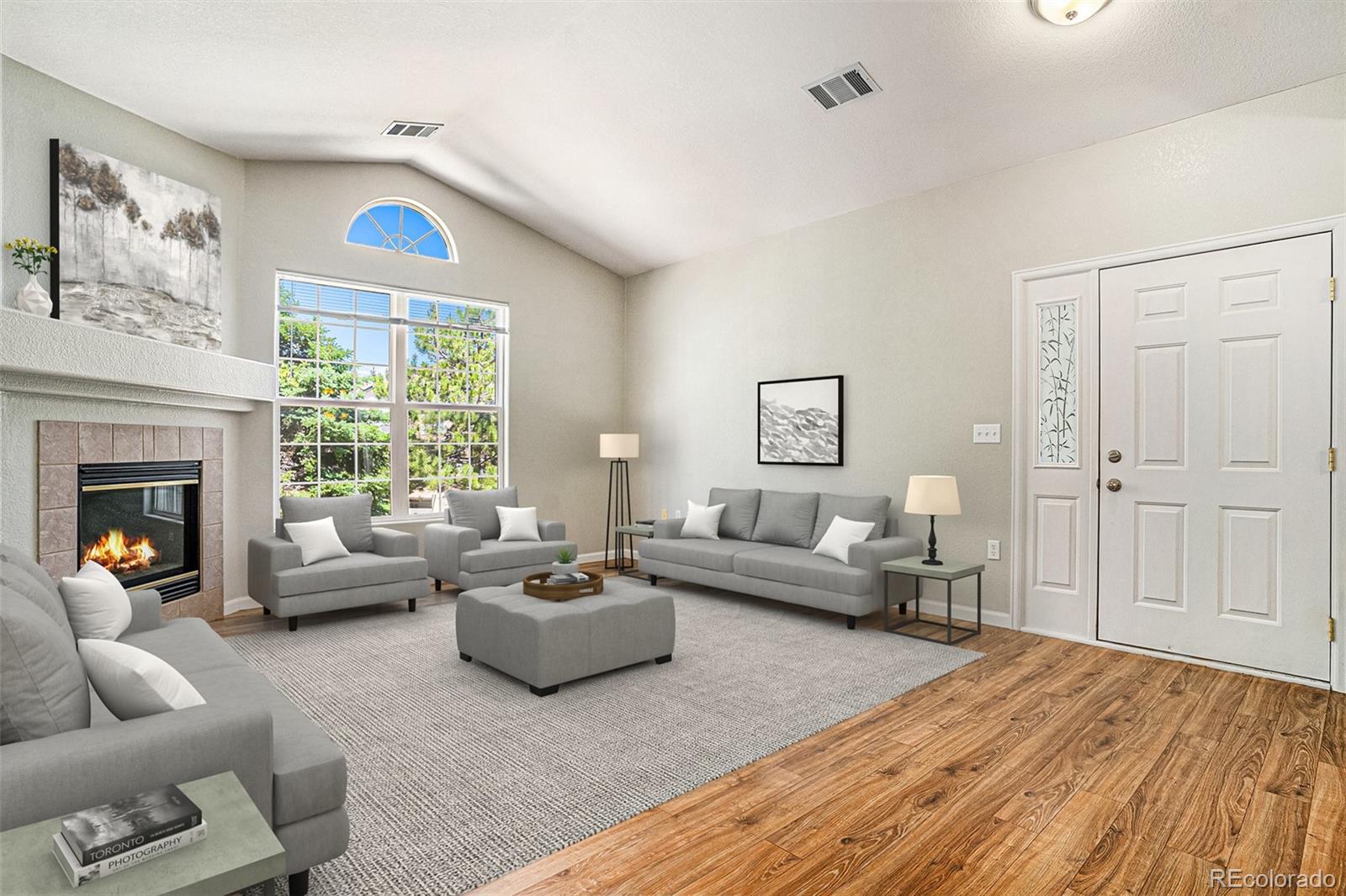 a living room with furniture and a large window