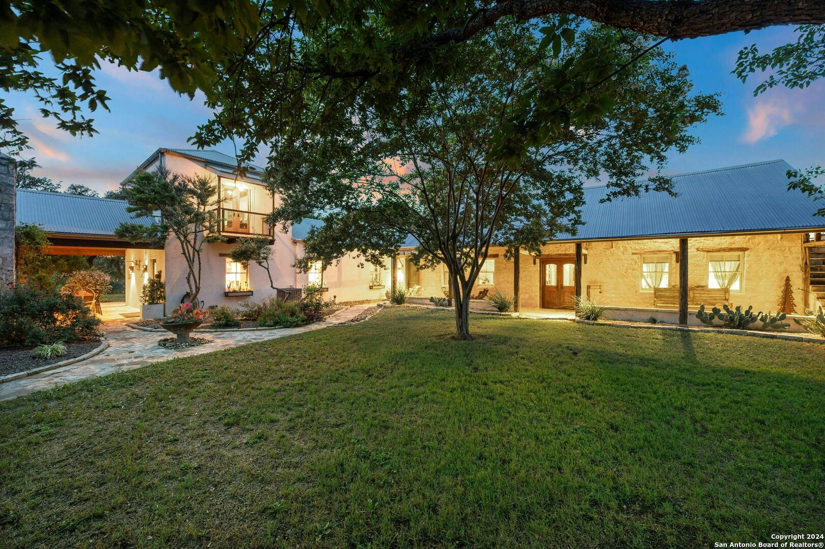 a view of a yard with a house in the background