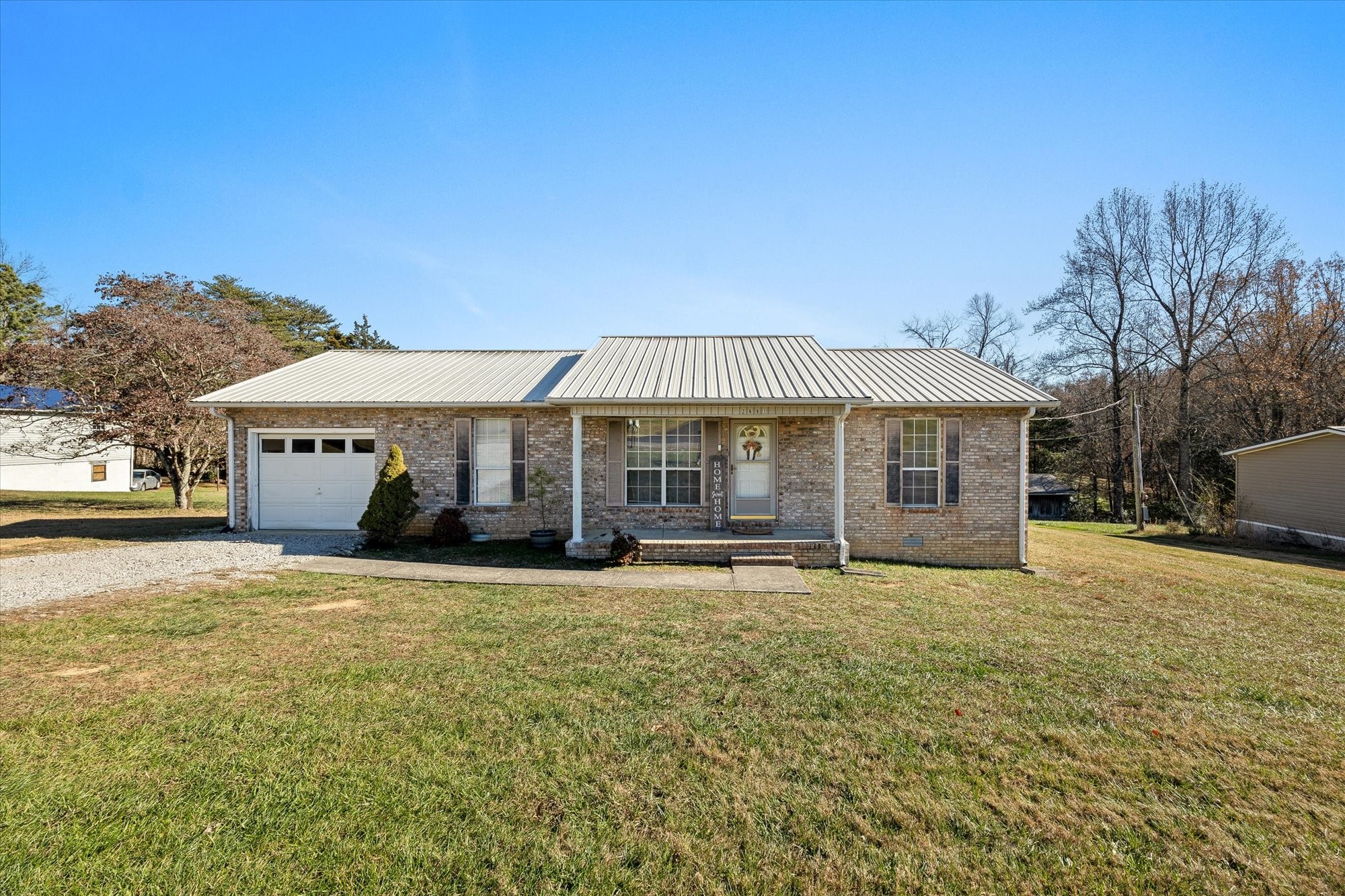 a front view of a house with a yard