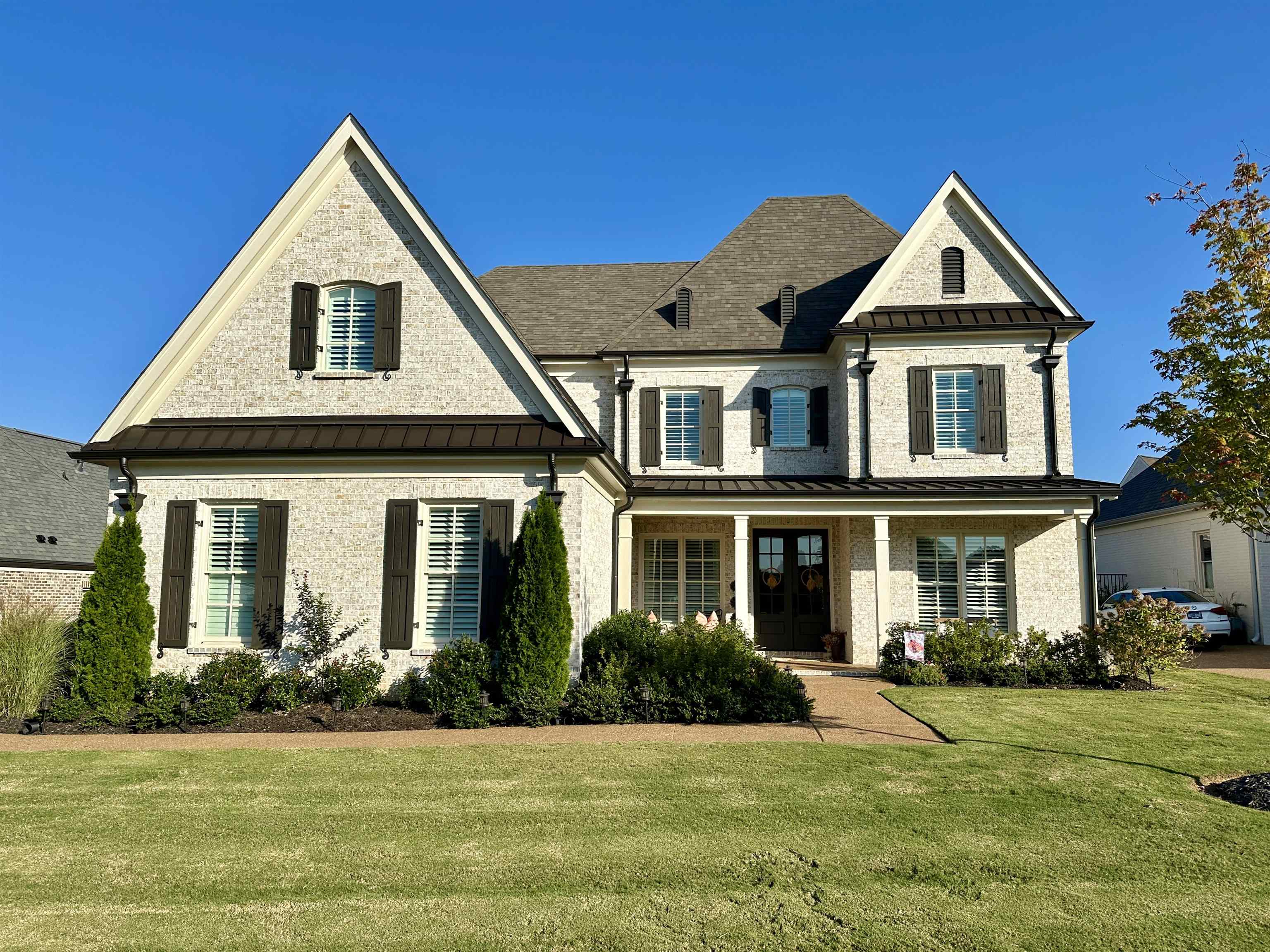 a front view of a house with a yard