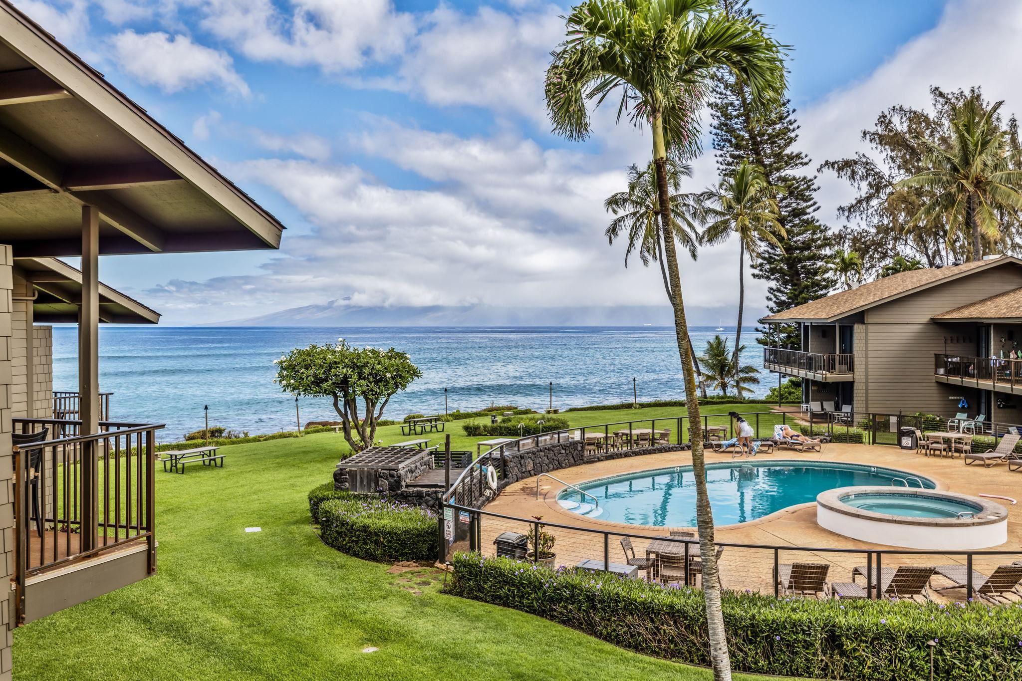 a swimming pool with an outdoor seating and yard