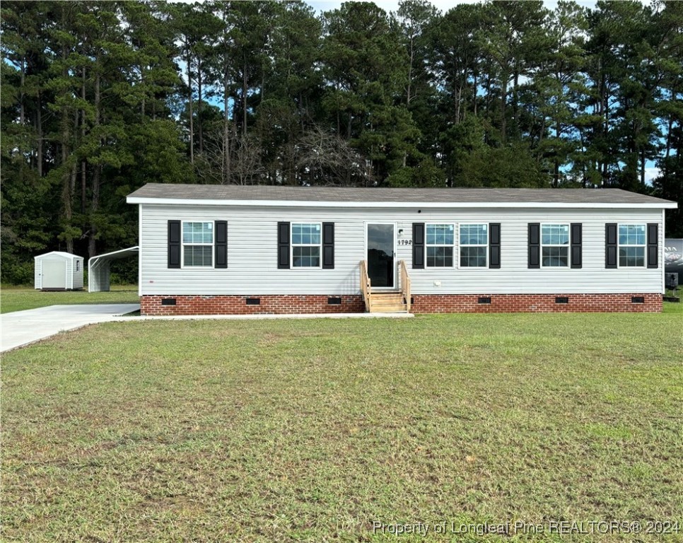 front view of a house with a yard