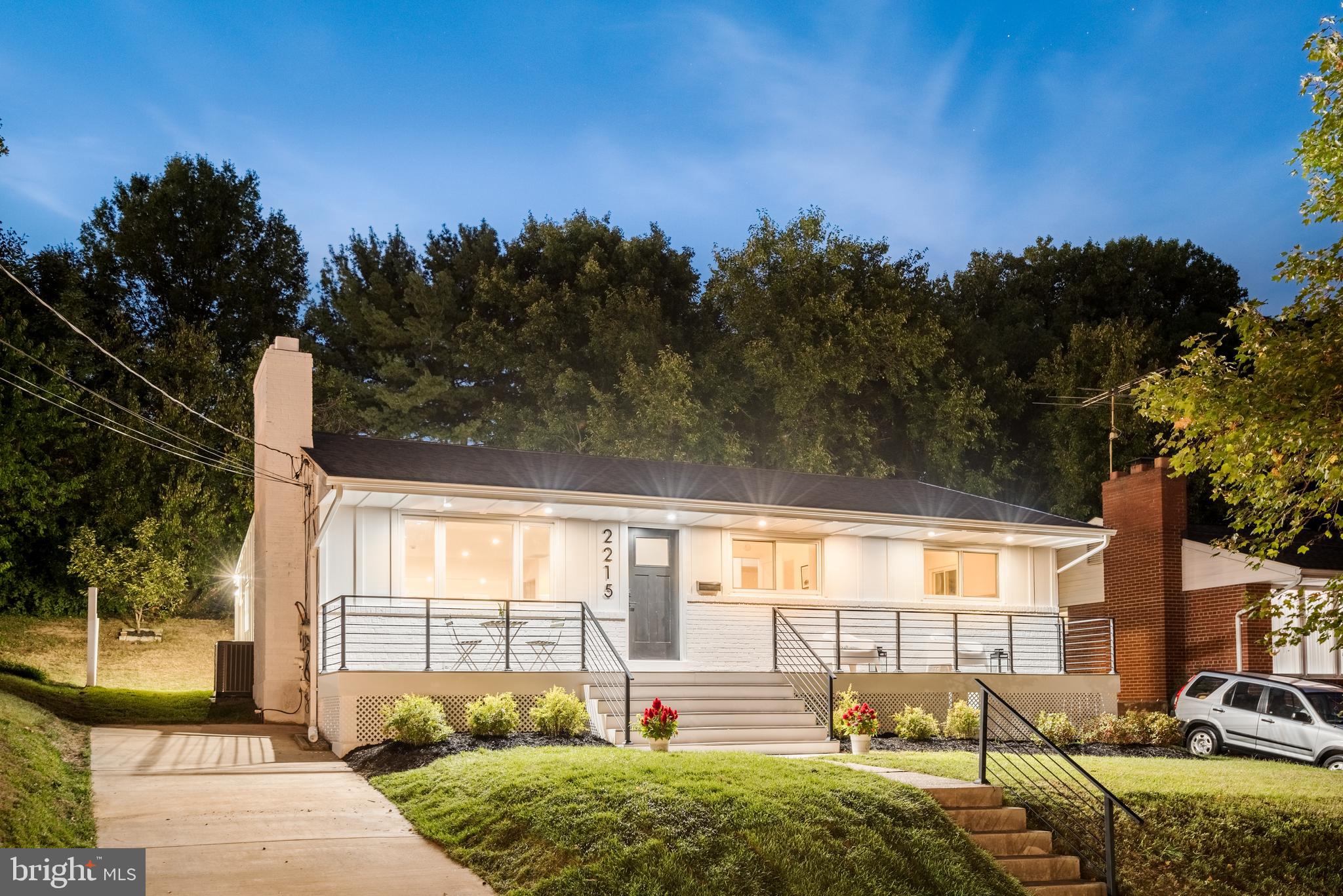 a view of a house with backyard and porch