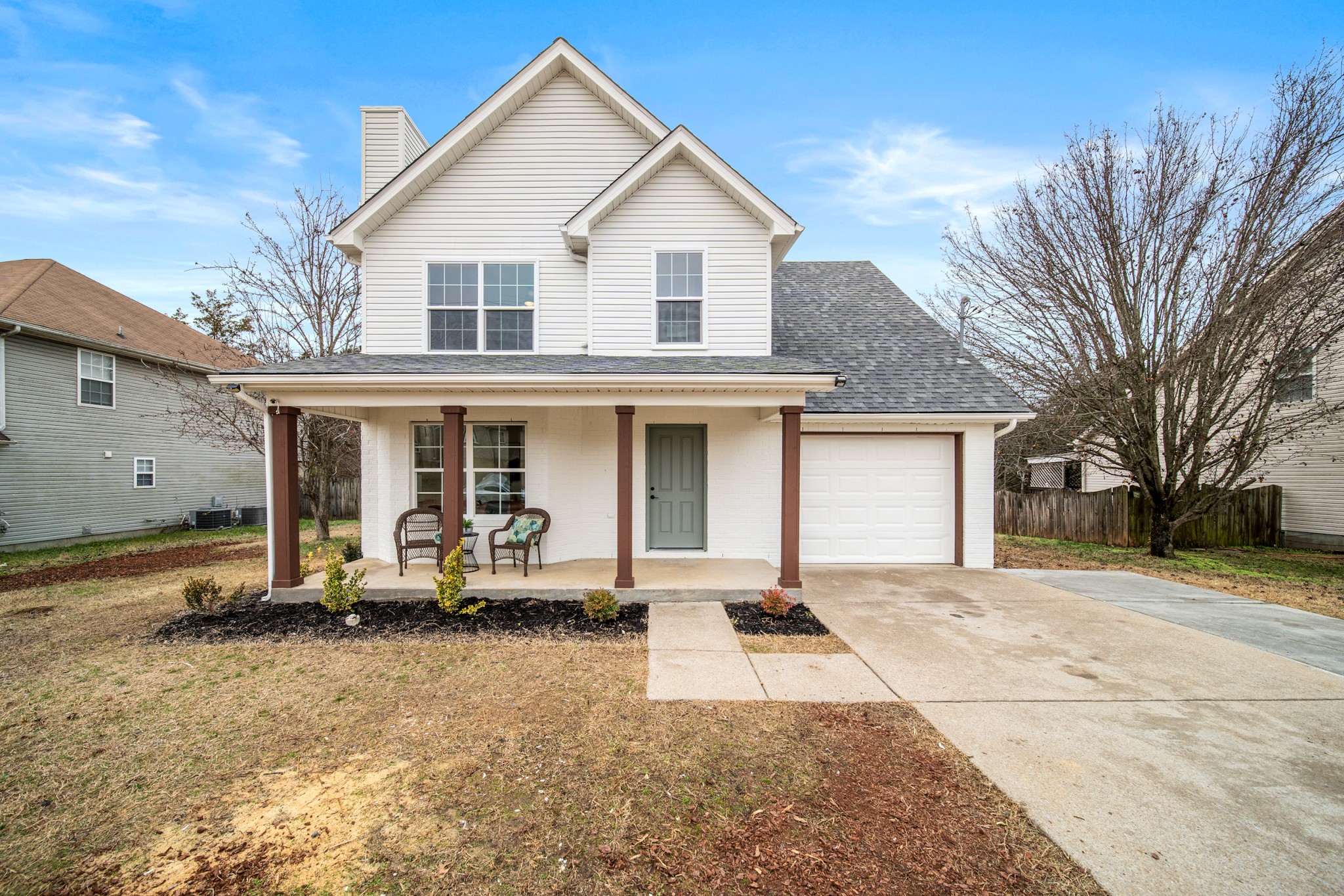 a front view of a house with a yard