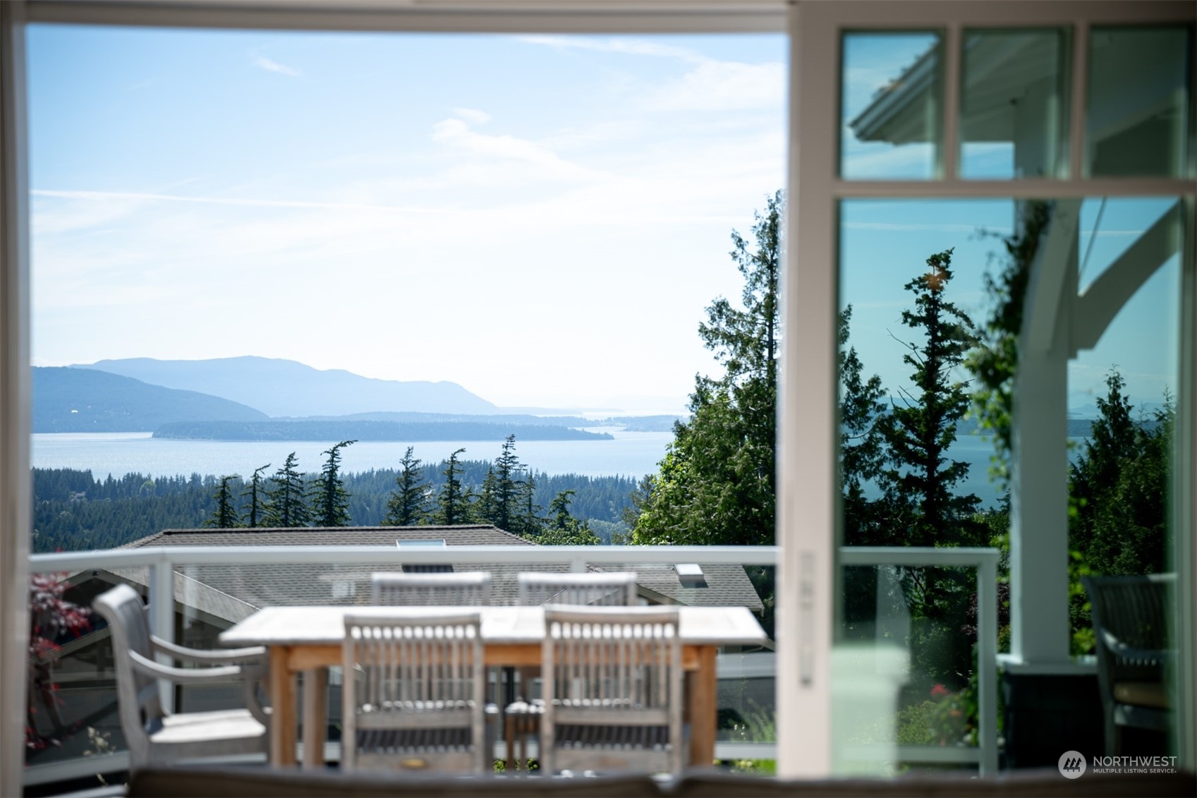 a view of balcony with outdoor seating and city view