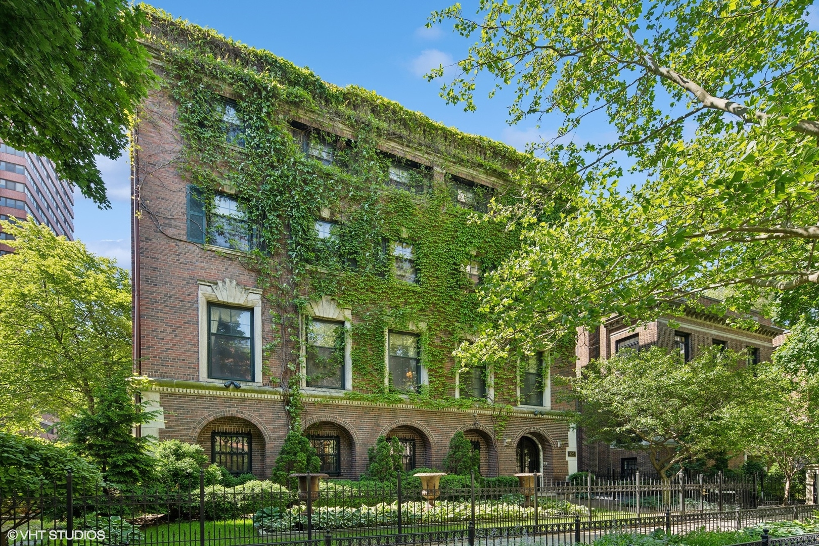 a front view of a building with garden