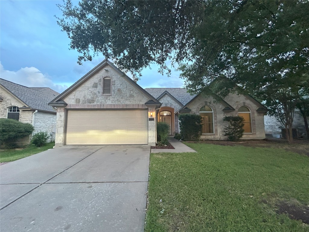 a front view of house with yard and green space