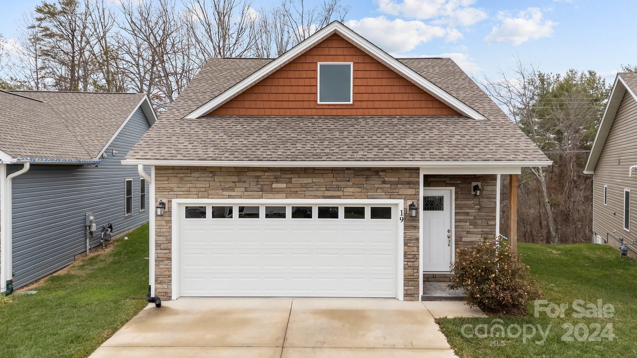 front view of a house with a yard