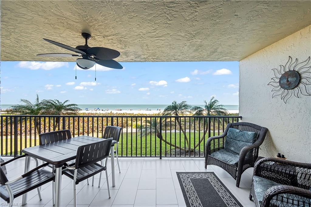 a view of a balcony with furniture