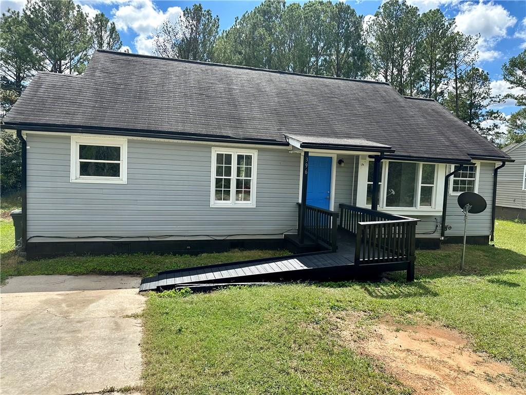 a backyard of a house with barbeque oven