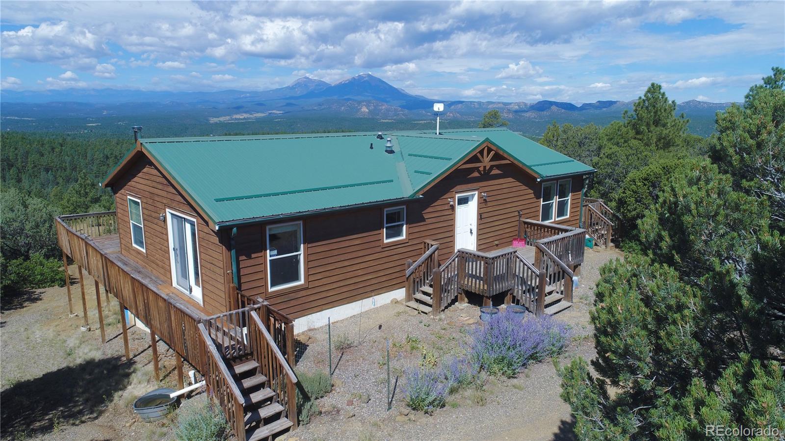 aerial view of a house with a yard