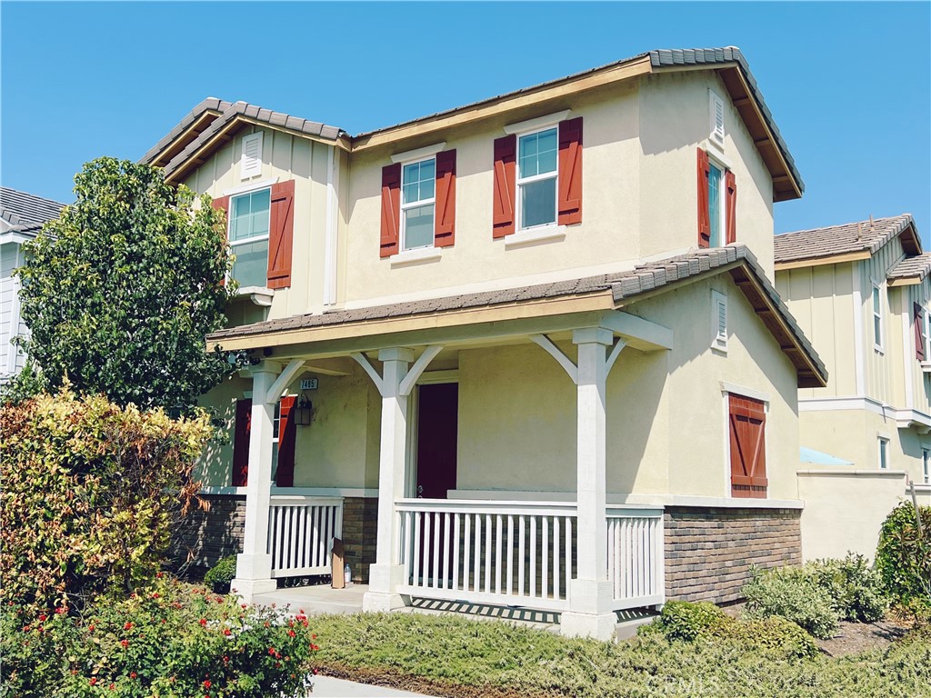 a front view of a house with garden