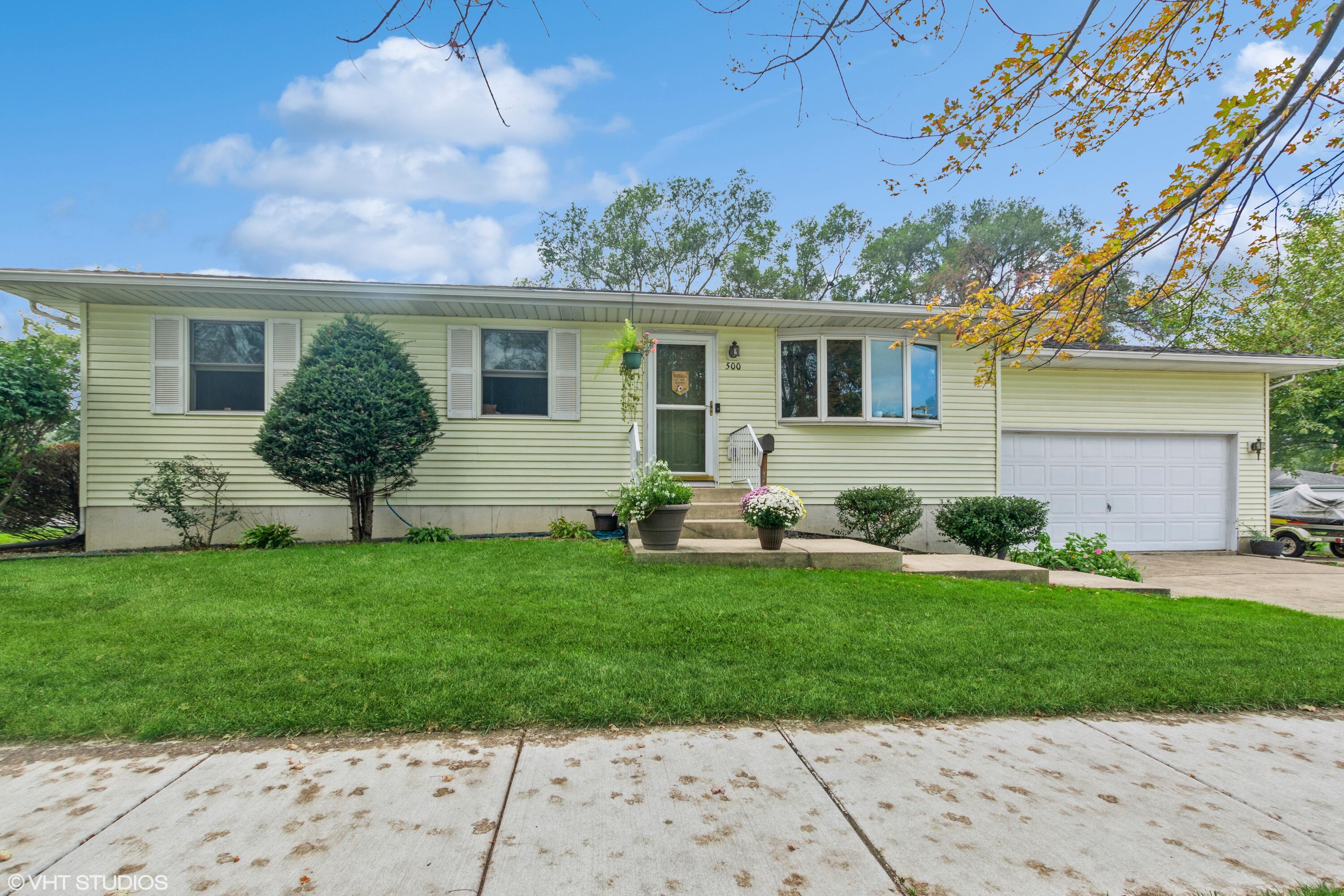 front view of a house with a yard