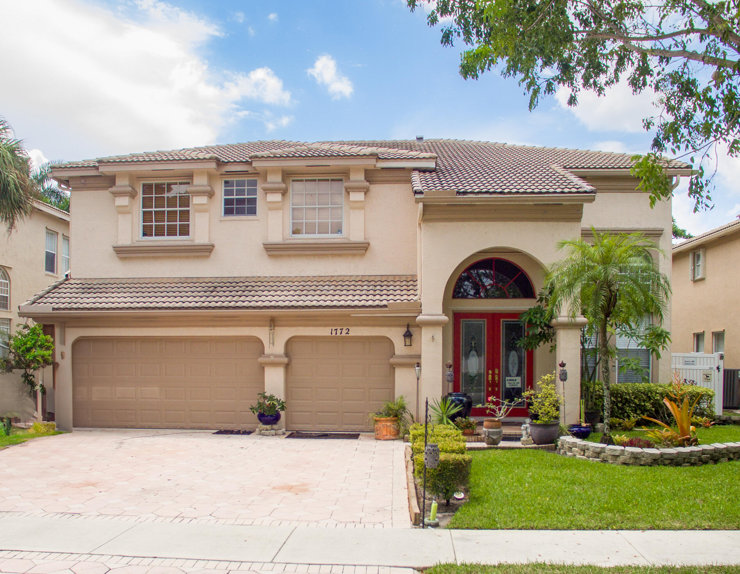 front view of a house with a yard